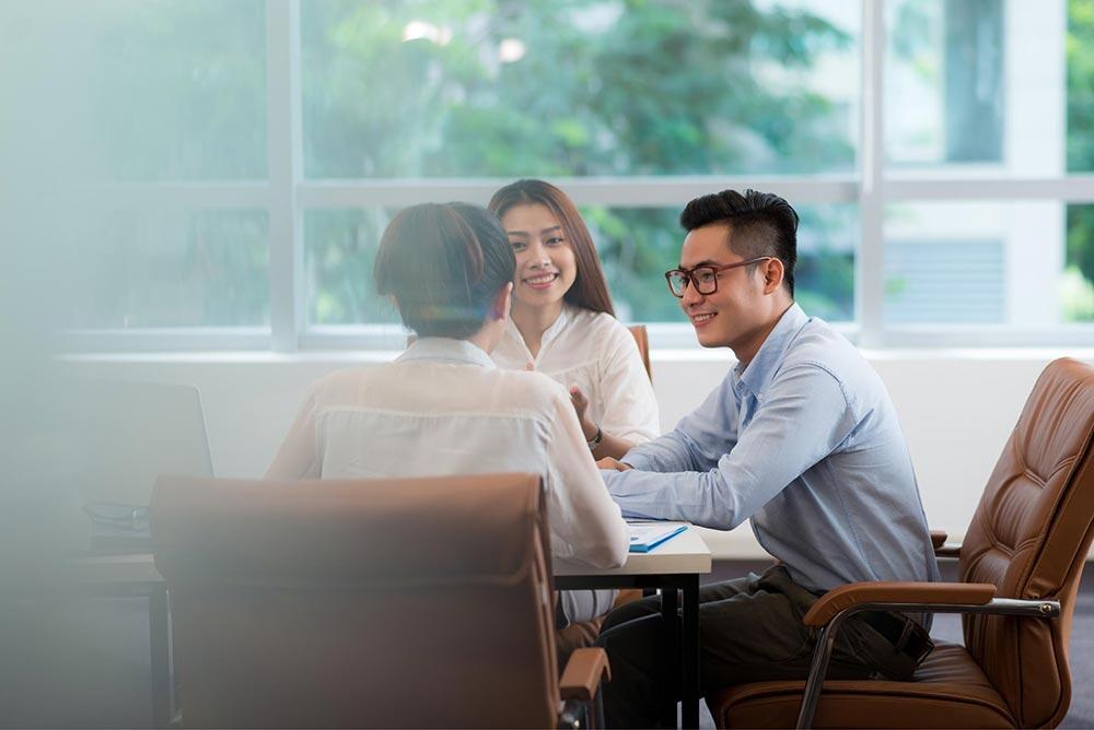 3 colleagues planning their work at a table