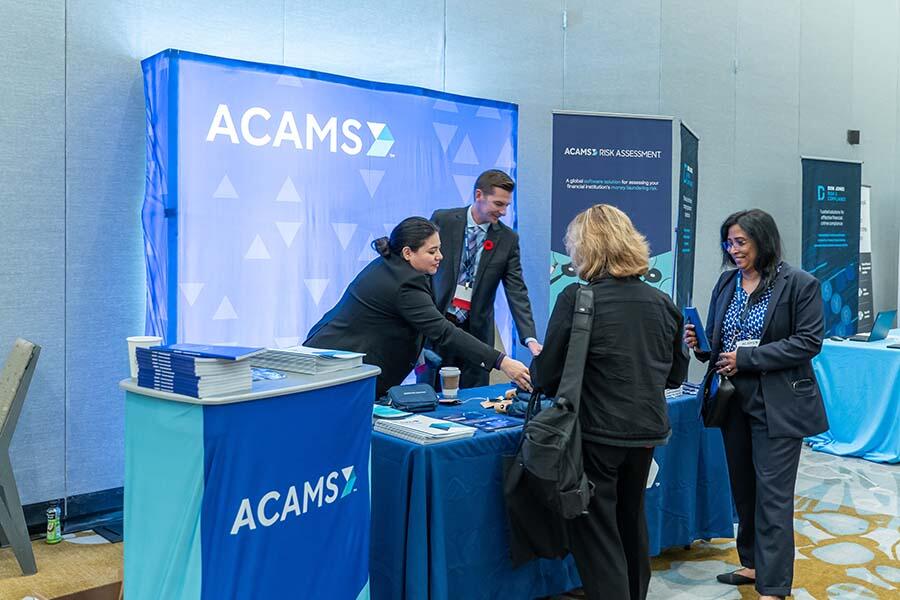 Attendees engaging in discussions at the ACAMS Conference, showcasing collaboration and innovation.