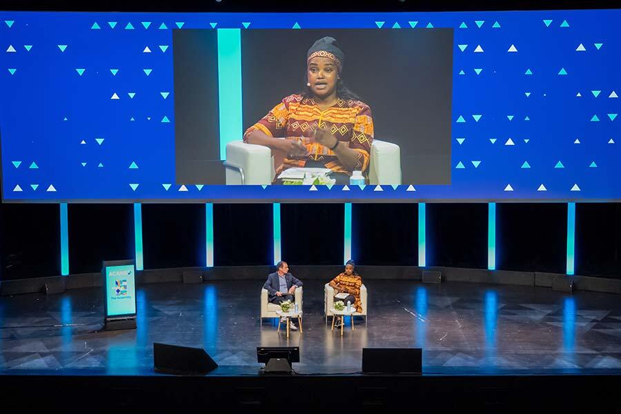 Two expert speakers talking in the ACAMS Europe Assembly auditorium